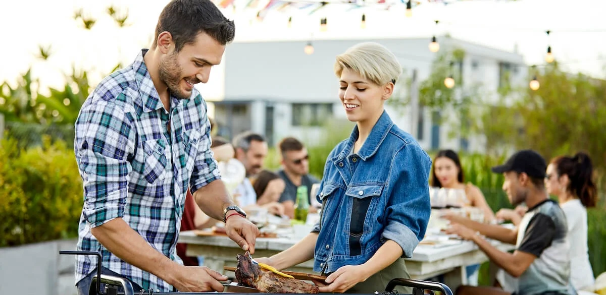 BBQ and group eating at table
