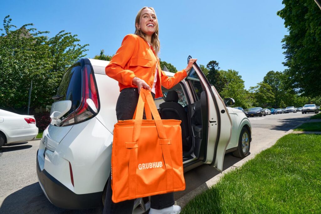Woman with a GrubHub styled bag