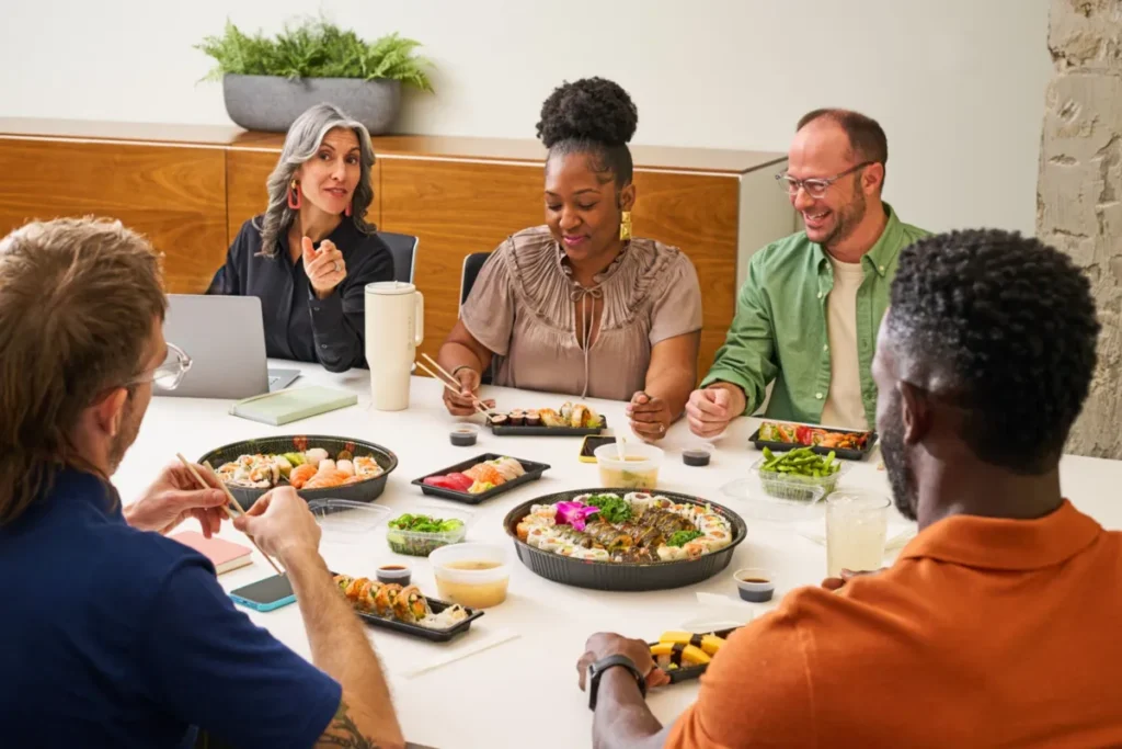 Group of people having sushi for lunch